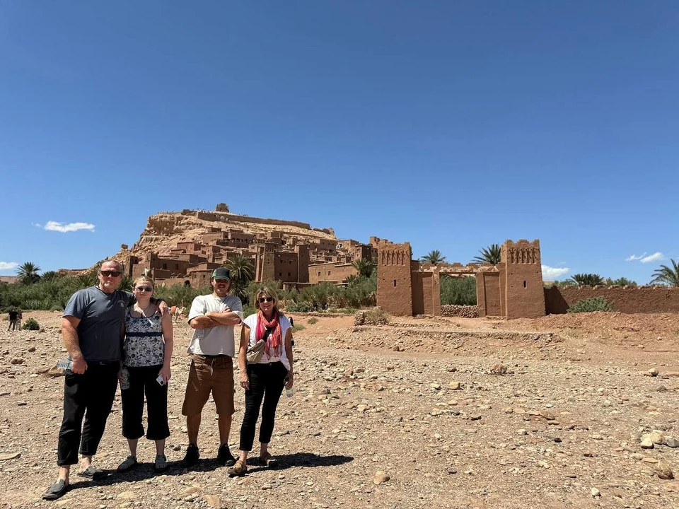 Travelers visiting a historic kasbah during a six-day Morocco tour from Casablanca
