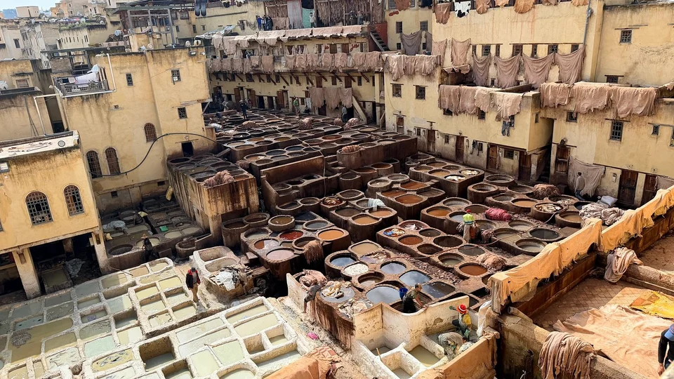 Traditional leather tanneries in Fes during a seven-day Morocco tour from Casablanca