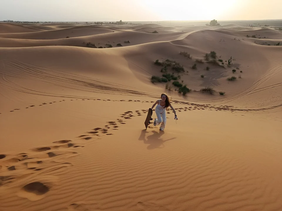 Traveler exploring the Sahara dunes during an eight-day Morocco tour from Casablanca