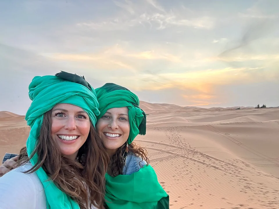 Travelers in desert scarves during a three-day Errachidia to Fes tour