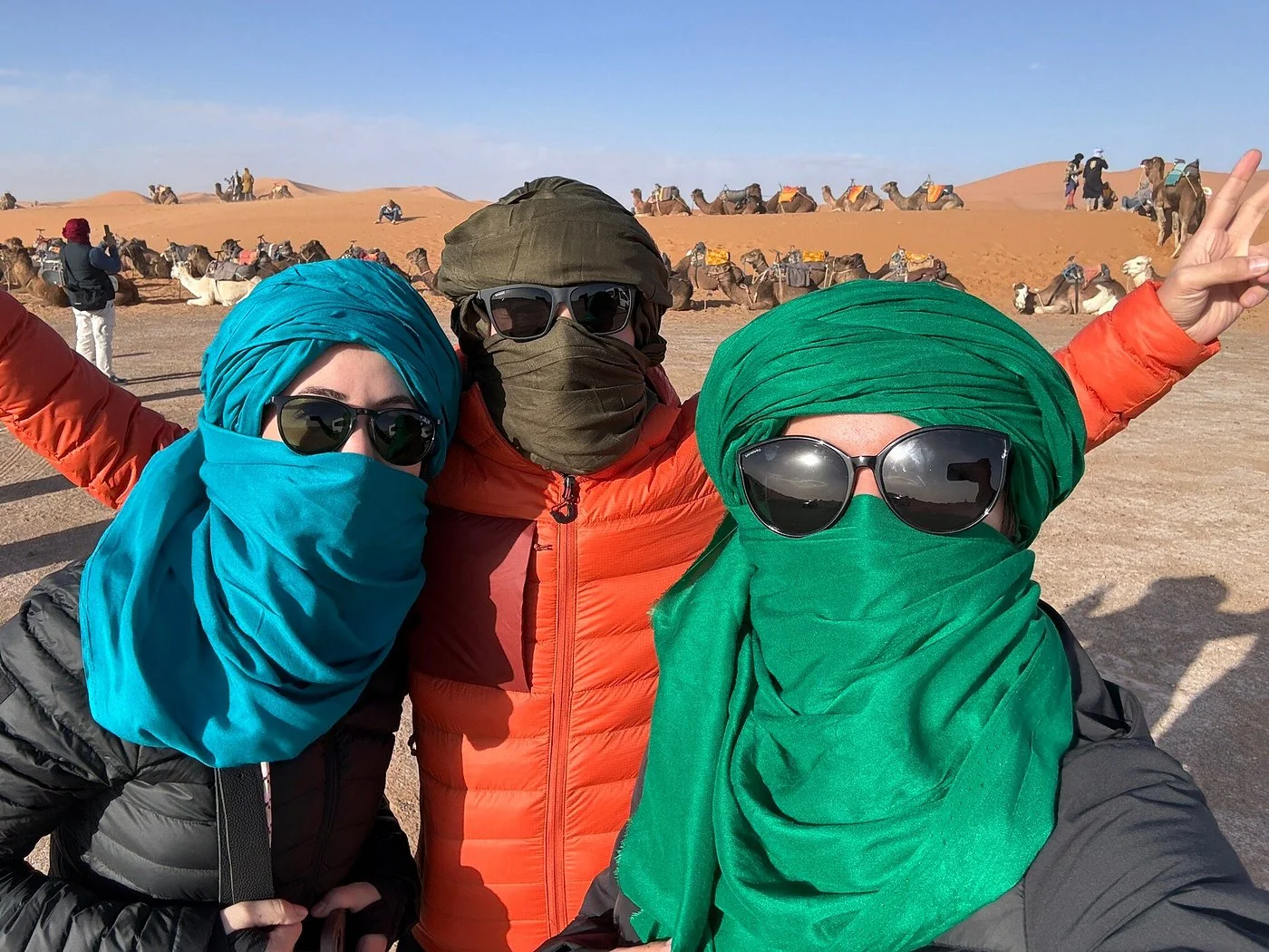 Travelers wearing desert scarves during a four-day Merzouga trip from Marrakech