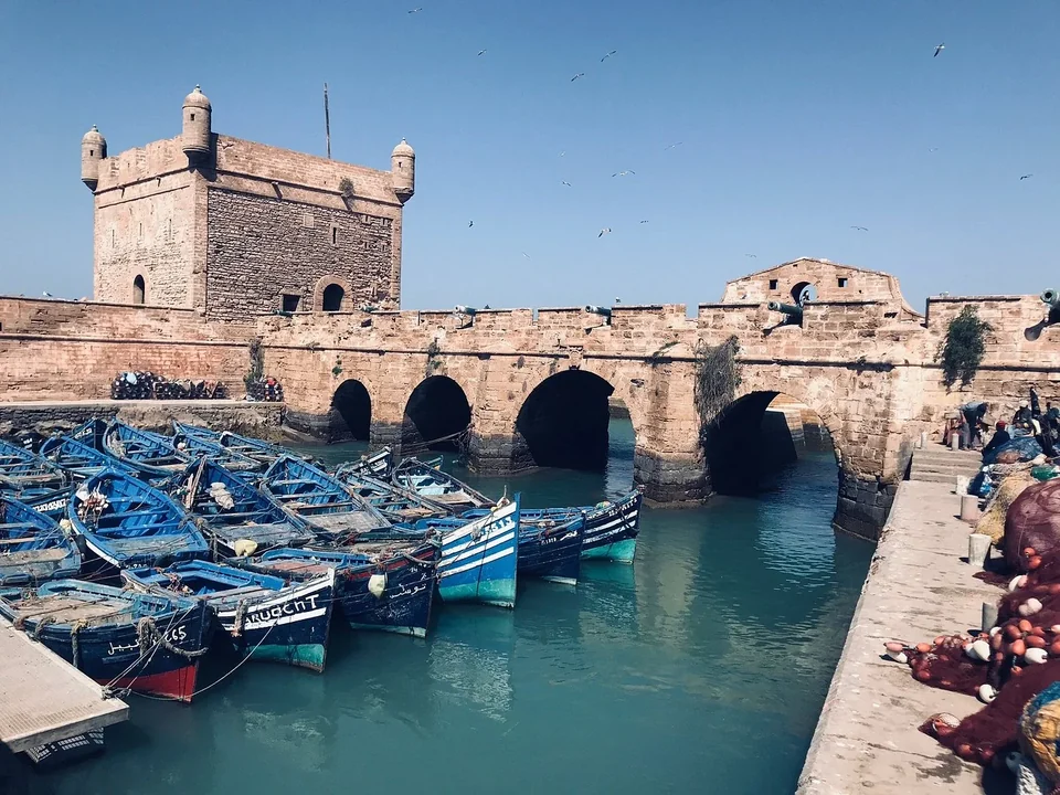 Blue fishing boats beside the historic Skala in Essaouira